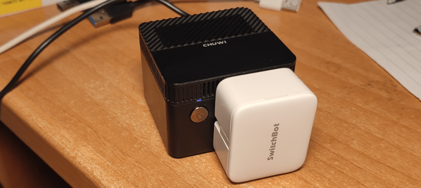 Switchbot BOT attached to a tiny Chuwi Mini-PC